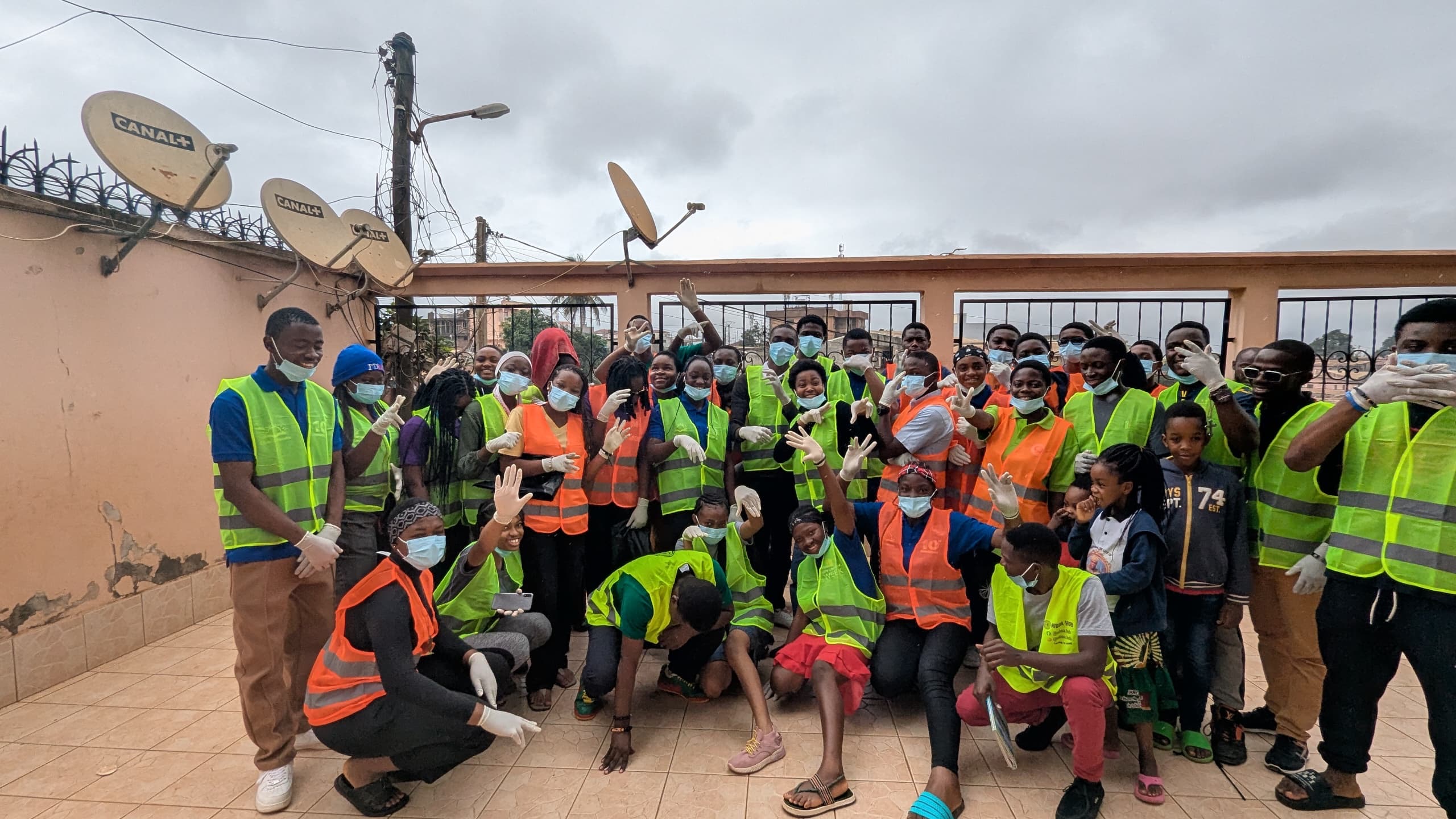 Youths posing excitedly for photos as they make WiseBoxes